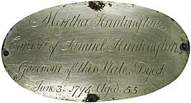 The medallion from Martha Huntington's coffin was cleaned up and attched to the new coffin.